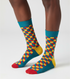 Funky Citrus crew socks flat lay showing orange, yellow, and lime green pattern