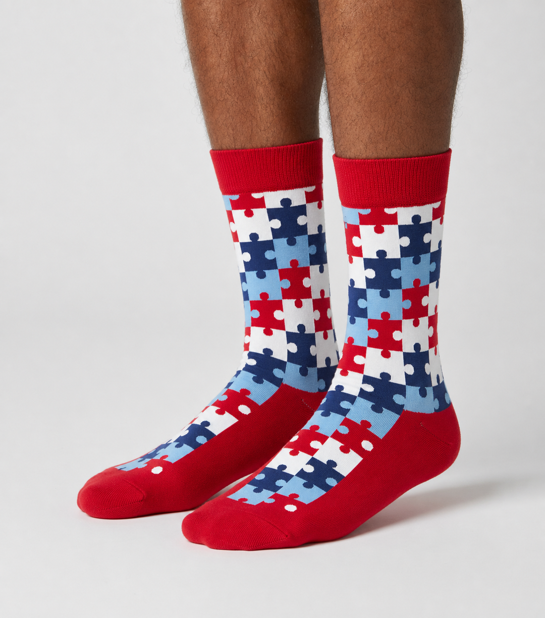 Funky Crimson Puzzle crew socks flat lay showing rich crimson interlocking puzzle pattern