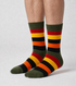 Olive Pine crew socks flat lay showing earthy olive base with red, orange, and gold stripe