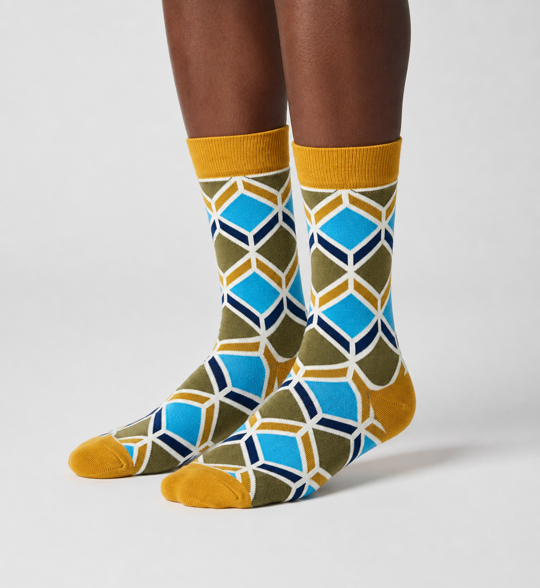 Sandstone Mosaic crew socks flat lay showing warm desert-tone geometric mosaic pattern