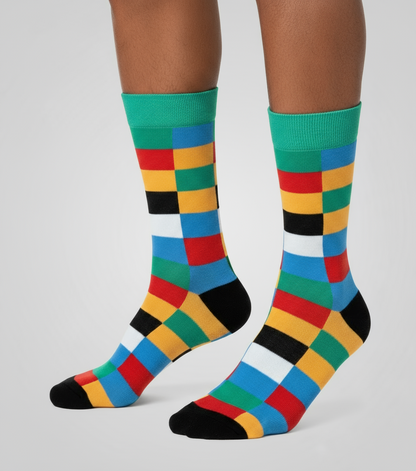 Urban Mosaic crew socks flat lay showing bold colorful geometric mosaic pattern