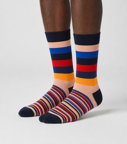 Varsity Block crew socks on model showing navy, peach, blue, red, and gold block stripe pattern